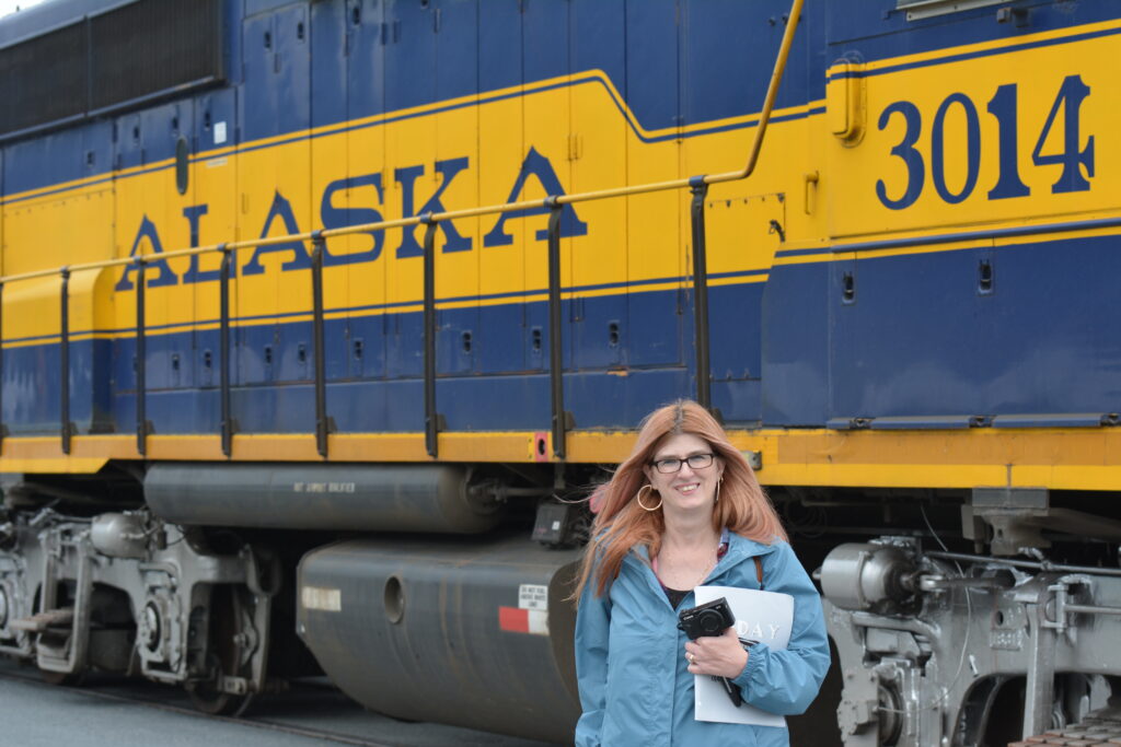 Kathleen Penner Plenty of Sunshine Travel Cruising the Waves Podcast owner Alaska Train Woman Cruise Podcast Cruise Travel Cruise Podcast